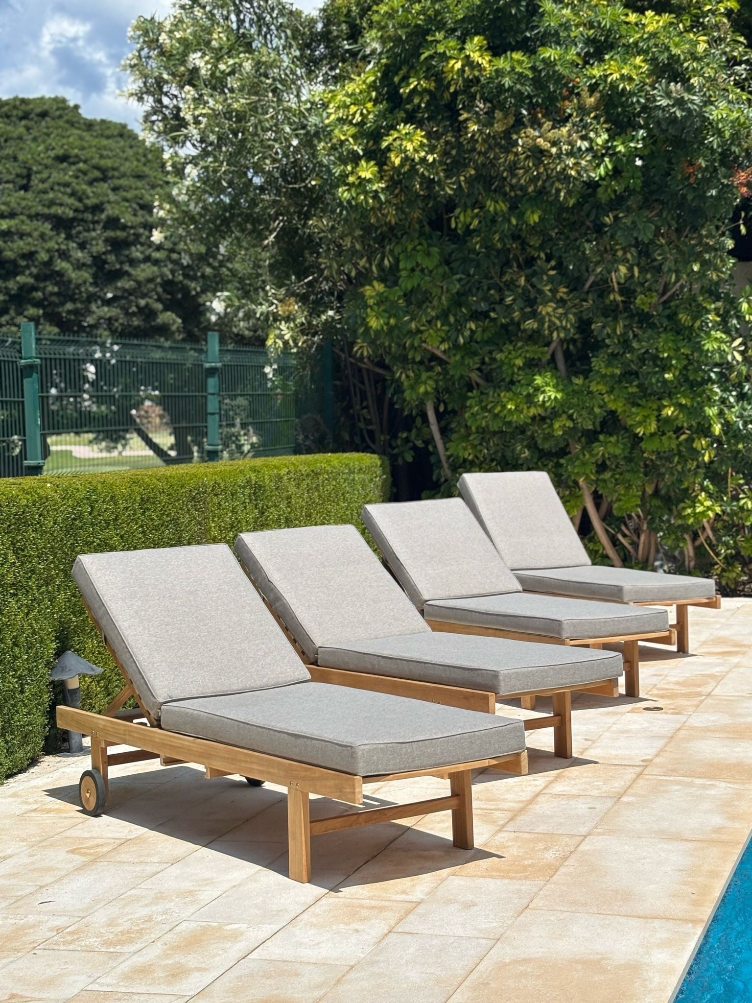 Teak sunbeds and deck chairs